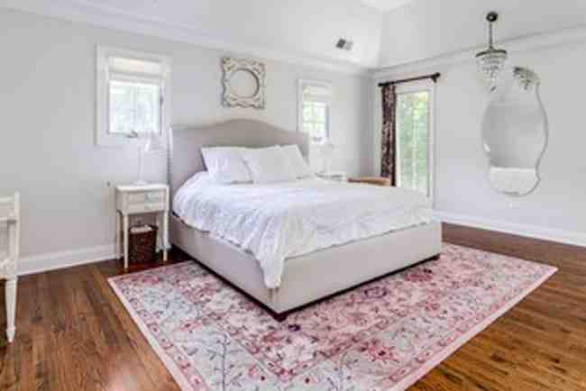 How to Place an Area Rug Under a Bed